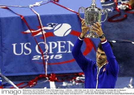 (150914) -- NEW YORK, Sept. 13, 2015 -- Novak Djokovic of Serbia lifts his champion trophy during the awarding ceremony for the men s singles event at the 2015 US Open in New York, the United States, on Sept. 13, 2015. Djokovic claimed the title of the event after beating Roger Federer of Switzerland 3-1. ) (SP)US-NEW YORK-TENNIS-US OPEN QinxLang 