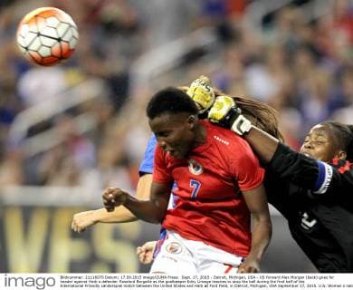 Sept. 17, 2015 - Detroit, Michigan, USA - US forward Alex Morgan (back) goes for header against Haiti s defender Roselord Borgella as the goalkeeper Edny Limage reaches to stop the ball during the first half of the International Friendly Länderspiel match between the United States and Haiti at Ford Field, in Detroit, Michigan, USA September 17, 2015. U.S. Women s national team Nationalteam vs. Haiti  - ZUMAn230
