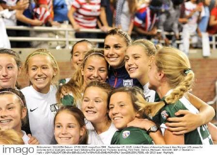 September 17, 2015: United States of America forward Alex Morgan (13) poses for pictures with a local girls soccer team following the game on Thursday evening, Ford Field, Detroit, Michigan. SOCCER: SEP 17 Women s - Haiti v USA Icon2581509170001 EDITORIAL USE ONLY