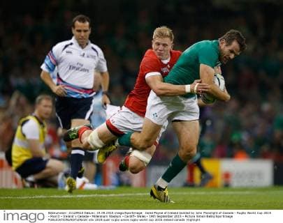Jared Payne of Ireland tackled by John Moonlight of Canada - Rugby World Cup 2015 - Pool D - Ireland v Canada - Millennium Stadium - Cardiff- Wales - 19th September 2015 - Picture Simon Bellis Sportimage EDITORIAL USE ONLY. No use with unauthorised audio, video, data, fixture lists, club league logos or live services. Online in-match use limited to 120 images, no video emulation. No use in betting, games or single club league player publications.