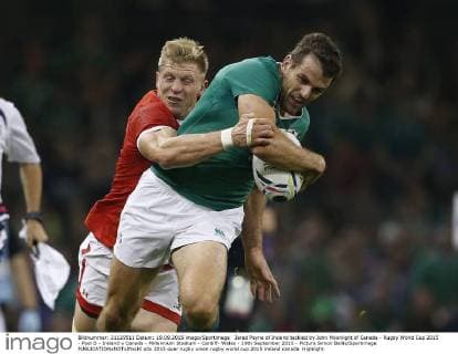 Jared Payne of Ireland tackled by John Moonlight of Canada - Rugby World Cup 2015 - Pool D - Ireland v Canada - Millennium Stadium - Cardiff- Wales - 19th September 2015 - Picture Simon Bellis Sportimage EDITORIAL USE ONLY. No use with unauthorised audio, video, data, fixture lists, club league logos or live services. Online in-match use limited to 120 images, no video emulation. No use in betting, games or single club league player publications.