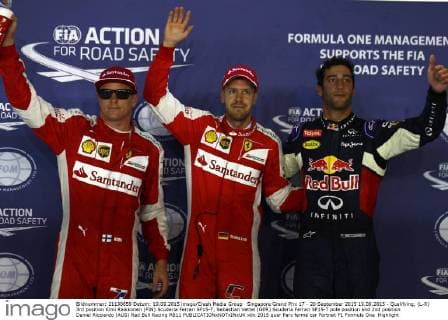 Singapore Grand Prix 17 - 20 September 2015 19.09.2015 - Qualifying, (L-R) 3rd position Kimi Raikkonen (FIN) Scuderia Ferrari SF15-T, Sebastian Vettel (GER) Scuderia Ferrari SF15-T pole position and 2nd position Daniel Ricciardo (AUS) Red Bull Racing RB11 