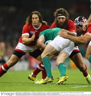 19.09.2015. Cardiff, Wales. Rugby World Cup. Ireland versus Canada. It takes Jeff Hassler and Hubert Buydens, of Canada to stop Keith Earls if Ireland. xPhilxHutchinsonx  ActionPlus11661903