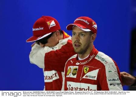 Singapore Grand Prix 17 - 20 September 2015 19.09.2015 - Qualifying, Kimi Raikkonen (FIN) Scuderia Ferrari SF15-T and Sebastian Vettel (GER) Scuderia Ferrari SF15-T pole position 