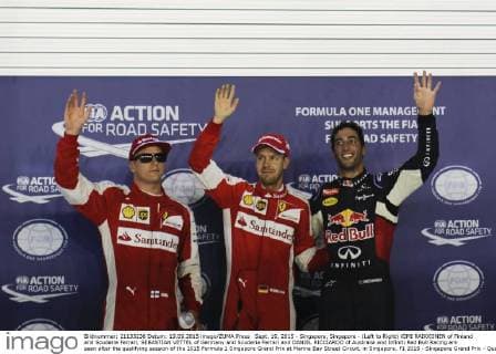 Sept. 19, 2015 - Singapore, Singapore - (Left to Right) KIMI RAIKKONEN of Finland and Scuderia Ferrari, SEBASTIAN VETTEL of Germany and Scuderia Ferrari and DANIEL RICCIARDO of Australia and Infiniti Red Bull Racing are seen after the qualifying session of the 2015 Formula 1 Singapore Grand Prix at Marina Bay Street Circuit, in Singapore. F1 2015 - Singapore Grand Prix - Qualifying - ZUMAg147