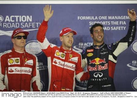 Sept. 19, 2015 - Singapore, Singapore - (Left to Right) KIMI RAIKKONEN of Finland and Scuderia Ferrari, SEBASTIAN VETTEL of Germany and Scuderia Ferrari and DANIEL RICCIARDO of Australia and Infiniti Red Bull Racing are seen after the qualifying session of the 2015 Formula 1 Singapore Grand Prix at Marina Bay Street Circuit, in Singapore. F1 2015 - Singapore Grand Prix - Qualifying - ZUMAg147