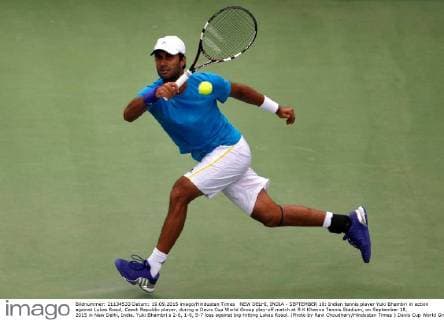NEW DELHI, INDIA - SEPTEMBER 18: Indian tennis player Yuki Bhambri in action against Lukas Rosol, Czech Republic player, during a Davis Cup World Group play-off match at R K Khanna Tennis Stadium, on September 18, 2015 in New Delhi, India. Yuki Bhambri s 2-6, 1-6, 5-7 loss against big-hitting Lukas Rosol. (Photo by Ravi Choudhary Hindustan Times ) Davis Cup World Group Play-Off