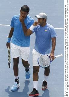 NEW DELHI, INDIA - SEPTEMBER 19: Indian tennis players Leander Paes and Rohan Bopanna in action during their doubles tennis match against Czech Republic s Adam Pavlasek and Radek Stepanek on the second day s play off of the Davis Cup between India and Czech Republic at R.K. Khanna Tennis Stadium, on September 19, 2015 in New Delhi, India. (Photo by Virendra Singh Gosain Hindustan Times ) Davis Cup World Group Play-Off