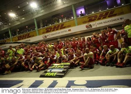 Singapore Grand Prix 17 - 20 September 2015 20.09.2015 - Race, Celebratrion, Sebastian Vettel (GER) Scuderia Ferrari SF15-T race winner and 3rd position Kimi Raikkonen (FIN) Scuderia Ferrari SF15-T 