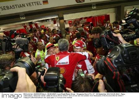 Singapore Grand Prix 17 - 20 September 2015 20.09.2015 - Race, Celebratrion, Sebastian Vettel (GER) Scuderia Ferrari SF15-T race winner and 3rd position Kimi Raikkonen (FIN) Scuderia Ferrari SF15-T 