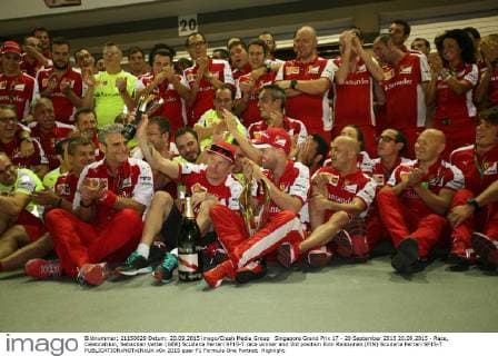 Singapore Grand Prix 17 - 20 September 2015 20.09.2015 - Race, Celebratrion, Sebastian Vettel (GER) Scuderia Ferrari SF15-T race winner and 3rd position Kimi Raikkonen (FIN) Scuderia Ferrari SF15-T 