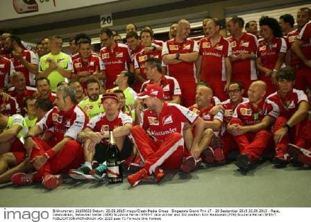 Singapore Grand Prix 17 - 20 September 2015 20.09.2015 - Race, Celebratrion, Sebastian Vettel (GER) Scuderia Ferrari SF15-T race winner and 3rd position Kimi Raikkonen (FIN) Scuderia Ferrari SF15-T 