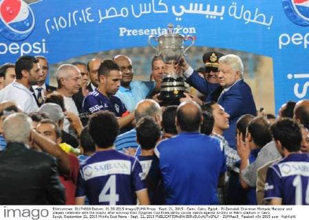 Sept. 21, 2015 - Cairo, Cairo, Egypt - El-Zamalek Chairman Mortada Mansour and players celebrate with the trophy after winning their Egyptian Cup finals derby soccer match against Al-Ahly at Petro stadium in Cairo, Egypt, September 21, 2015 Middle East News - Sept. 21, 2015 - ZUMAap3_