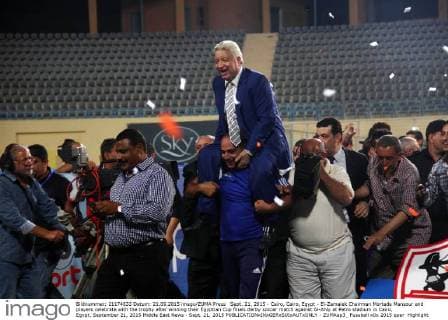 Sept. 21, 2015 - Cairo, Cairo, Egypt - El-Zamalek Chairman Mortada Mansour and players celebrate with the trophy after winning their Egyptian Cup finals derby soccer match against Al-Ahly at Petro stadium in Cairo, Egypt, September 21, 2015 Middle East News - Sept. 21, 2015 - ZUMAap3_