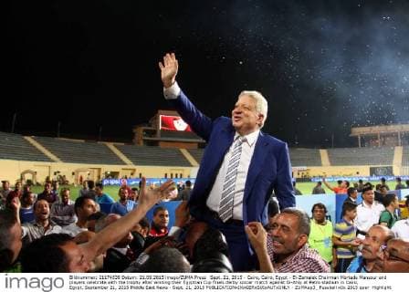 Sept. 21, 2015 - Cairo, Cairo, Egypt - El-Zamalek Chairman Mortada Mansour and players celebrate with the trophy after winning their Egyptian Cup finals derby soccer match against Al-Ahly at Petro stadium in Cairo, Egypt, September 21, 2015 Middle East News - Sept. 21, 2015 - ZUMAap3_