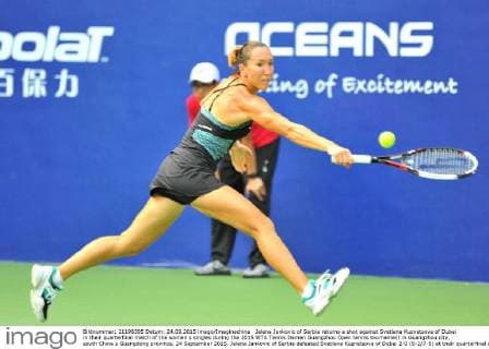 Jelena Jankovic of Serbia returns a shot against Svetlana Kuznetsova of Dubai in their quarterfinal match of the women s singles during the 2015 WTA Tennis Damen Guangzhou Open tennis tournament in Guangzhou city, south China s Guangdong province, 24 September 2015. Jelena Jankovic of Serbia defeated Svetlana Kuznetsova of Dubai 2-0 (6-2 7-5) at their quarterfinal of the women s singles during the 2015 WTA Guangzhou Open tennis tournament. Jelena Jankovic eliminates Svetlana Kuznetsova at quarterfinal of WTA Guangzhou Open  20150924_65834