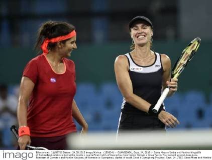 (150924) -- GUANGZHOU, Sept. 24, 2015 -- Sania Mirza of India and Martina Hingis(R) of Switzerland celebrate during the double s quarterfinal match of Guangzhou Internationl Women s Open Tennis Tournament against Anna-Lena Friedsam of Germany and Monica Niculescu of Romania in Guangzhou, capital of south China s Guangdong Province, Sept. 24, 2015. Sania Mirza and Martina Hingis won 2-0. )(wll) (SP)CHINA-GUANGZHOU-TENNIS-INTERNATIONAL WOMEN S OPEN-QUARTERFINAL LiangxXu 