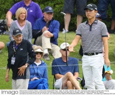 Sept. 24, 2015 - Atlanta, GA, USA - Sangmoon Bae tosses his putter after missing his birdie putt on the second hole during the Tour Championship at East Lake Golf Club on Thusday, Sept. 24, 2015, in Atlanta, Ga. Watson was able to scramble to save his par on the hole. Tour Championship - ZUMAm67_
