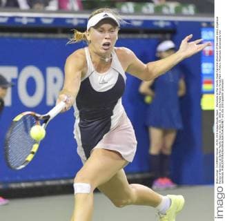 Wozniacki at Pan Pacific Open Caroline Wozniacki of Denmark plays Angelique Kerber of Germany at the Pan Pacific Open on Sept. 25, 2015, at the Ariake Tennis Forest Park in Tokyo. Wozniacki advanced to the semifinals. 