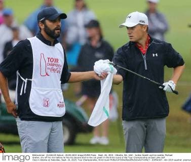 Sept. 26, 2015 - Atlanta, GA, USA - Jordan Spieth and his caddie, Michael Greller, dry off his iron before he hits his second shot to the 1st green in the third round of the Tour Championship at East Lake Golf Club in Atlanta on Saturday, Sept. 26, 2015. Tour Championship, third round - ZUMAm67_