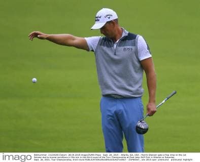 Sept. 26, 2015 - Atlanta, GA, USA - Henrik Stenson gets a free drop on the 1st fairway due to course conditions in the rain in the third round of the Tour Championship at East Lake Golf Club in Atlanta on Saturday, Sept. 26, 2015. Tour Championship, third round - ZUMAm67_