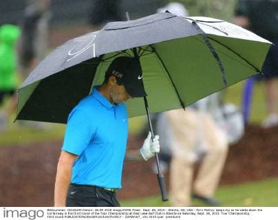 Sept. 26, 2015 - Atlanta, GA, USA - Rory McIlroy keeps dry as he walks down the 1st fairway in the third round of the Tour Championship at East Lake Golf Club in Atlanta on Saturday, Sept. 26, 2015. Tour Championship, third round - ZUMAm67_