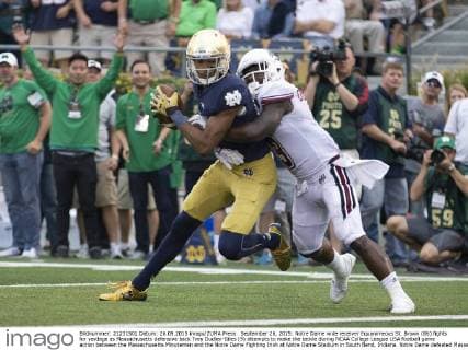 September 26, 2015: Notre Dame wide receiver Equanimeous St. Brown (86) fights for yardage as Massachusetts defensive back Trey Dudley-Giles (9) attempts to make the tackle during NCAA College League USA football game action between the Massachusetts Minutemen and the Notre Dame Fighting Irish at Notre Dame Stadium in South Bend, Indiana. Notre Dame defeated Massachusetts 62-27. NCAA Football 2015: Massachusetts vs Notre Dame SEP 26 - ZUMAc04_