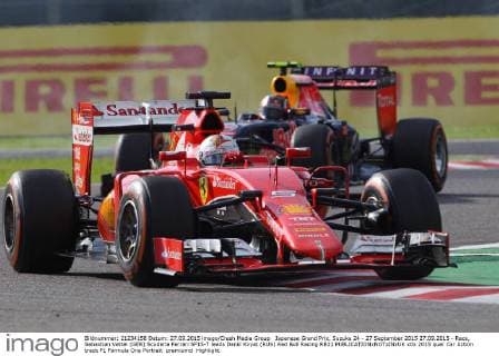 Japanese Grand Prix, Suzuka 24 - 27 September 2015 27.09.2015 - Race, Sebastian Vettel (GER) Scuderia Ferrari SF15-T leads Daniil Kvyat (RUS) Red Bull Racing RB11 
