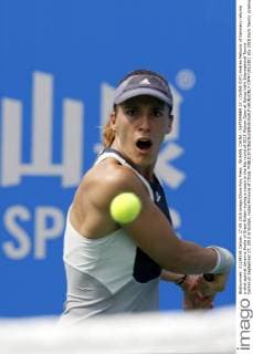 WUHAN, CHINA - SEPTEMBER 27: (CHINA OUT) Andrea Petkovic of Germany returns a shot against Johanna Konta of Great Britain during a match in the fist round of 2015 Wuhan Open at Optics Vally International Tennis Center on September 27, 2015 in Wuhan, Hubei Province of China.  CFP473512381 