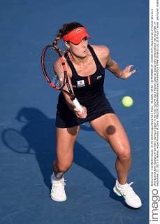 WUHAN, CHINA - SEPTEMBER 27: (CHINA OUT) Alize Cornet of France returns a shot against Julia Goerges of Germany during a match in the first round of 2015 Wuhan Open at Optics Vally International Tennis Center on September 27, 2015 in Wuhan, Hubei Province of China.  CFP473518602 