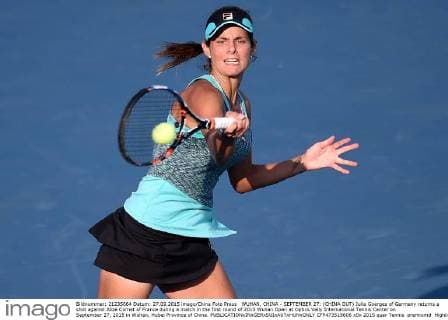 WUHAN, CHINA - SEPTEMBER 27: (CHINA OUT) Julia Goerges of Germany returns a shot against Alize Cornet of France during a match in the first round of 2015 Wuhan Open at Optics Vally International Tennis Center on September 27, 2015 in Wuhan, Hubei Province of China.  CFP473518606 
