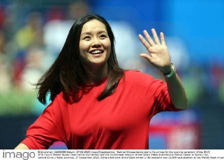 Retired Chinese tennis star Li Na arrives for the opening ceremony of the 2015 WTA Tennis Damen Wuhan Open tennis tournament and the 15,000-seat stadium at the Optics Valley International Tennis Center in Wuhan city, central China s Hubei province, 27 September 2015. China s two-time Grand Slam winner Li Na opened a new 15,000-seat stadium at the Wuhan Open in central China Sunday (27 September 2015) to huge cheers from her hometown fans. The new stadium has been built on the back of Li s career success, she was the first Asian to win a Grand Slam singles, that saw the popularity of tennis surge in China. Huge applause echoed through the stadium as Li, now retired, stepped onto the court wearing a red dress and was joined by the tournament s defending champion Petra Kvitova to open the new stadium officially. Similar in capacity to Wimbledon s centre court, the new stadium is dwarfed only by the US Open s Arthur Ashe stadium which has a capacity of 23,000. It has a retractable roof and a metal and glass structure reminiscent of the iconic bird s nest stadium in Beijing, the centrepiece of the 2008 Olympics. Li Na thrills fans at Wuhan stadium opening  20150927_12925