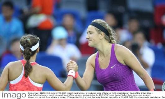 Victoria Azarenka of Belarus, right, greets Lauren Davis of the United States after defeating Davis in their first round match of the women s singles during the 2015 WTA Tennis Damen Wuhan Open tennis tournament in Wuhan city, central China s Hubei province, 27 September 2015. Victoria Azarenka defeated Lauren Davis 2-0 (6 2, 7 6). Victoria Azarenka beats Lauren Davis at Wuhan Open  20150927_15780