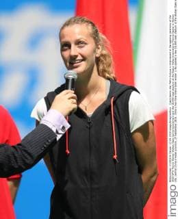 Czech tennis star Petra Kvitova is interviewed at the opening ceremony of the 2015 WTA Tennis Damen Wuhan Open tennis tournament and the 15,000-seat stadium at the Optics Valley International Tennis Center in Wuhan city, central China s Hubei province, 27 September 2015. China s two-time Grand Slam winner Li Na opened a new 15,000-seat stadium at the Wuhan Open in central China Sunday (27 September 2015) to huge cheers from her hometown fans. The new stadium has been built on the back of Li s career success, she was the first Asian to win a Grand Slam singles, that saw the popularity of tennis surge in China. Huge applause echoed through the stadium as Li, now retired, stepped onto the court wearing a red dress and was joined by the tournament s defending champion Petra Kvitova to open the new stadium officially. Similar in capacity to Wimbledon s centre court, the new stadium is dwarfed only by the US Open s Arthur Ashe stadium which has a capacity of 23,000. It has a retractable roof and a metal and glass structure reminiscent of the iconic bird s nest stadium in Beijing, the centrepiece of the 2008 Olympics. Li Na thrills fans at Wuhan stadium opening  20150927_66317