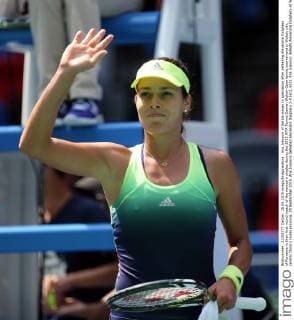 Ana Ivanovic of Serbia waves to spectators after defeating Alexandra Dulgheru of Romania in their first round match of the women s singles during the 2015 WTA Tennis Damen Wuhan Open tennis tournament in Wuhan city, central China s Hubei province, 28 September 2015. Ana Ivanovic defeated Alexandra Dulgheru 2-0 (6 1, 6 3). Ana Ivanovic defeats Alexandra Dulgheru at Wuhan Open  20150928_33126