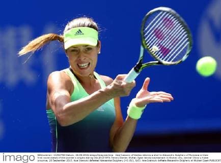 Ana Ivanovic of Serbia returns a shot to Alexandra Dulgheru of Romania in their first round match of the women s singles during the 2015 WTA Tennis Damen Wuhan Open tennis tournament in Wuhan city, central China s Hubei province, 28 September 2015. Ana Ivanovic defeated Alexandra Dulgheru 2-0 (6 1, 6 3). Ana Ivanovic defeats Alexandra Dulgheru at Wuhan Open  20150928_49748
