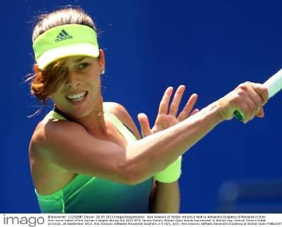 Ana Ivanovic of Serbia returns a shot to Alexandra Dulgheru of Romania in their first round match of the women s singles during the 2015 WTA Tennis Damen Wuhan Open tennis tournament in Wuhan city, central China s Hubei province, 28 September 2015. Ana Ivanovic defeated Alexandra Dulgheru 2-0 (6 1, 6 3). Ana Ivanovic defeats Alexandra Dulgheru at Wuhan Open  20150928_64744