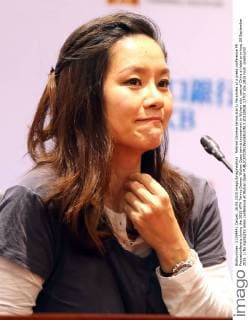 Retired Chinese tennis star Li Na smiles at a press conference PK Pressekonferenz during the 2015 WTA Tennis Damen Wuhan Open tennis tournament in Wuhan city, central China s Hubei province, 28 September 2015. Li Na highlights press conference at Wuhan Open  20150928_13707