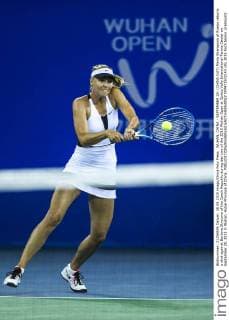 WUHAN, CHINA - SEPTEMBER 28: (CHINA OUT) Maria Sharapova of Russia returns a shot against Barbora Strycova of the Czech Republic during day two of the 2015 Wuhan Open at Optics Vally International Tennis Center on September 28, 2015 in Wuhan, Hubei Province of China.  CFP473572143 