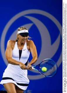 WUHAN, CHINA - SEPTEMBER 28: (CHINA OUT) Maria Sharapova of Russia returns a shot against Barbora Strycova of the Czech Republic during day two of the 2015 Wuhan Open at Optics Vally International Tennis Center on September 28, 2015 in Wuhan, Hubei Province of China.  CFP473572148 