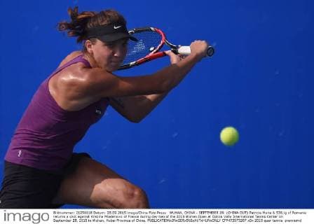WUHAN, CHINA - SEPTEMBER 28: (CHINA OUT) Patricia Maria & 538;ig of Romania returns a shot against Kristina Mladenovic of France during day two of the 2015 Wuhan Open at Optics Vally International Tennis Center on September 28, 2015 in Wuhan, Hubei Province of China.  CFP473573207 