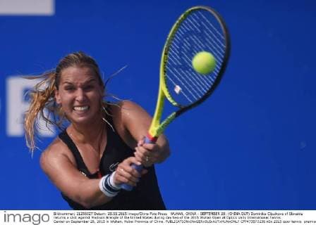 WUHAN, CHINA - SEPTEMBER 28: (CHINA OUT) Dominika Cibulkova of Slovakia returns a shot against Madison Brengle of the United States during day two of the 2015 Wuhan Open at Optics Vally International Tennis Center on September 28, 2015 in Wuhan, Hubei Province of China.  CFP473573236 