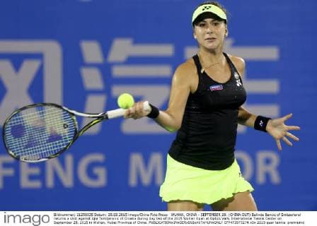 WUHAN, CHINA - SEPTEMBER 28: (CHINA OUT) Belinda Bencic of Switzerland returns a shot against Ajla Tomljanovic of Croatia during day two of the 2015 Wuhan Open at Optics Vally International Tennis Center on September 28, 2015 in Wuhan, Hubei Province of China.  CFP473573274 