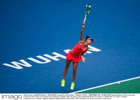WUHAN, CHINA - SEPTEMBER 28: (CHINA OUT) Caroline Garcia of France serves to Sara Errani of Italy during day two of the 2015 Wuhan Open at Optics Vally International Tennis Center on September 28, 2015 in Wuhan, Hubei Province of China.  CFP473573653 