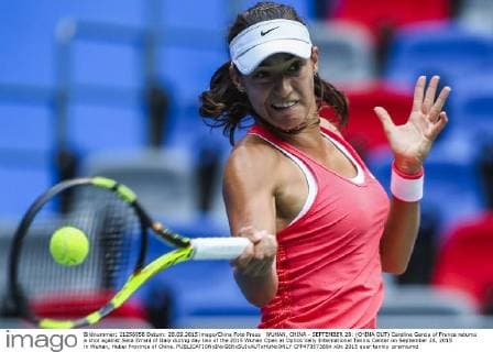 WUHAN, CHINA - SEPTEMBER 28: (CHINA OUT) Caroline Garcia of France returns a shot against Sara Errani of Italy during day two of the 2015 Wuhan Open at Optics Vally International Tennis Center on September 28, 2015 in Wuhan, Hubei Province of China.  CFP473573664 