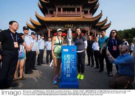 WUHAN, CHINA - SEPTEMBER 28: (CHINA OUT) Retired Chinese tennis star Li Na and Martina Hingis of Switzerland visit the Yellow Grane Tower during day two of the 2015 Wuhan Open on September 28, 2015 in Wuhan, Hubei Province of China.  CFP473573909 