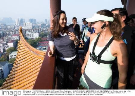 WUHAN, CHINA - SEPTEMBER 28: (CHINA OUT) Retired Chinese tennis star Li Na and Martina Hingis of Switzerland visit the Yellow Grane Tower during day two of the 2015 Wuhan Open on September 28, 2015 in Wuhan, Hubei Province of China.  CFP473573911 