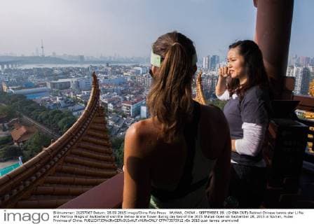 WUHAN, CHINA - SEPTEMBER 28: (CHINA OUT) Retired Chinese tennis star Li Na and Martina Hingis of Switzerland visit the Yellow Grane Tower during day two of the 2015 Wuhan Open on September 28, 2015 in Wuhan, Hubei Province of China.  CFP473573912 