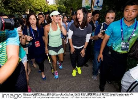 WUHAN, CHINA - SEPTEMBER 28: (CHINA OUT) Retired Chinese tennis star Li Na and Martina Hingis of Switzerland visit the Yellow Grane Tower during day two of the 2015 Wuhan Open on September 28, 2015 in Wuhan, Hubei Province of China.  CFP473573915 