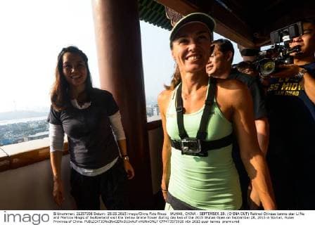 WUHAN, CHINA - SEPTEMBER 28: (CHINA OUT) Retired Chinese tennis star Li Na and Martina Hingis of Switzerland visit the Yellow Grane Tower during day two of the 2015 Wuhan Open on September 28, 2015 in Wuhan, Hubei Province of China.  CFP473573926 